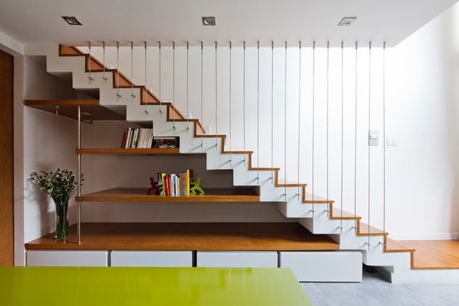 Kiểu thiết kế cầu thang không dùng tay vịn được ưa chuộng trong thiết kế nhà ống giúp tạo cảm giác rộng rãi thoáng đãng cho ngôi nhà