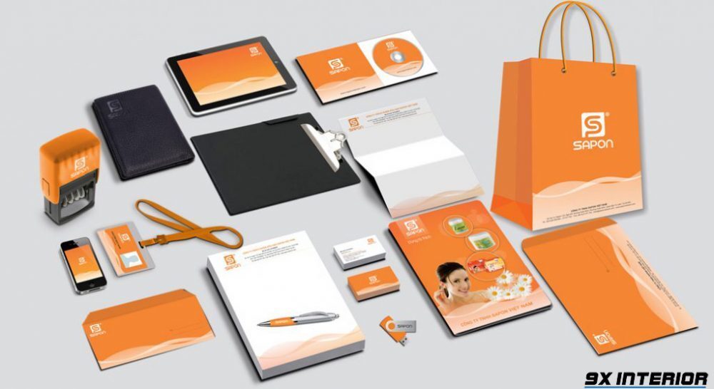 Một bộ nhận diện thương hiệu được thiết kế trên card visit, con dấu, notebook, túi xách